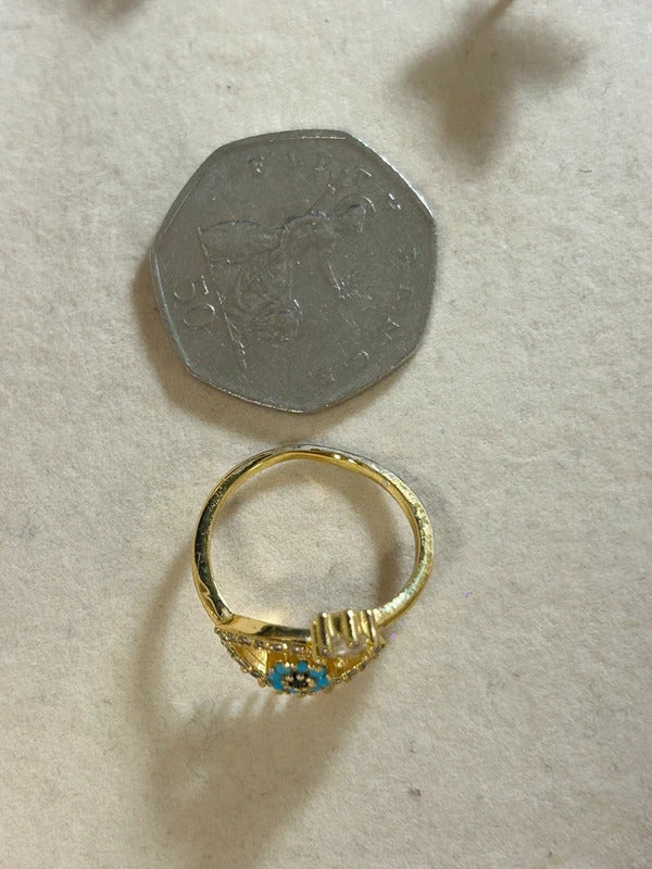 gold tone evil eye adjustable ring with blue stones
