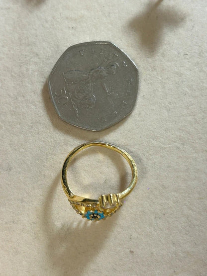gold tone evil eye adjustable ring with blue stones