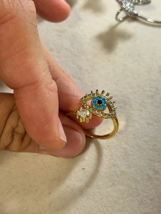 gold tone evil eye adjustable ring with blue stones