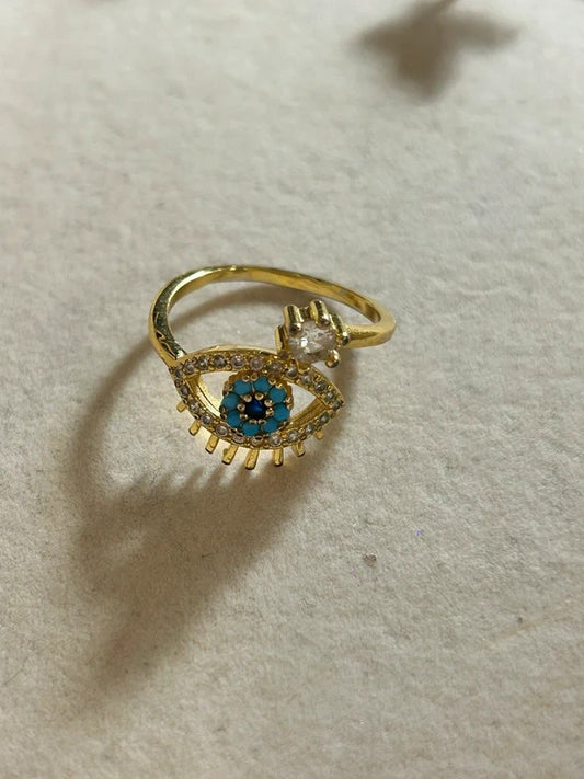 gold tone evil eye adjustable ring with blue stones