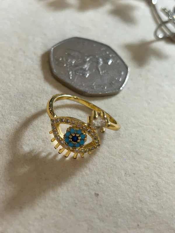 gold tone evil eye adjustable ring with blue stones